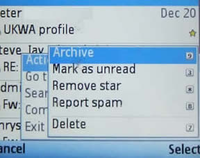 The GMail client menu, showing Archive, mark as unread, remove star, report spam and delete, each with keys attached.