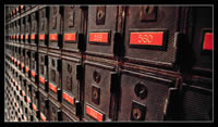 A multitude of small postboxes in rows, all with little locks.